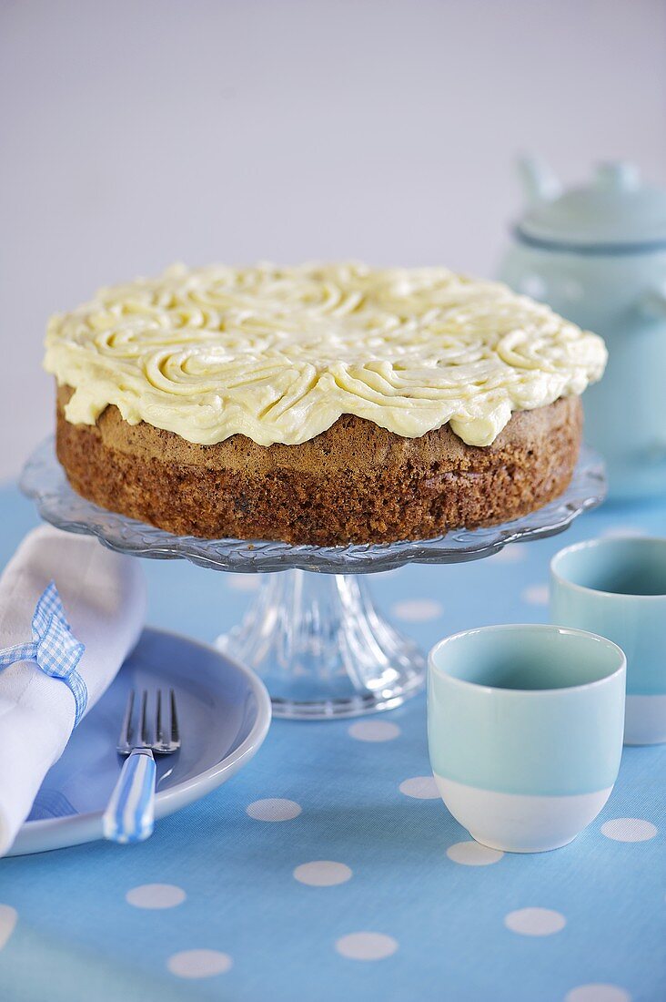 A carrot cake on a cake stand