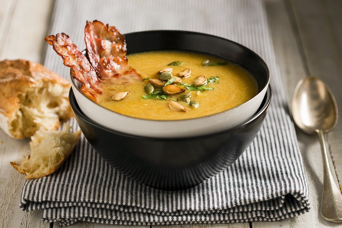 Pumpkin soup with bacon and pumpkin seeds
