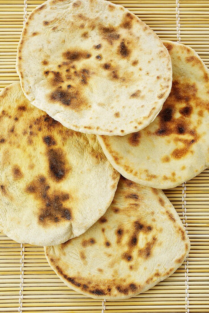 Pita bread on a bamboo mat