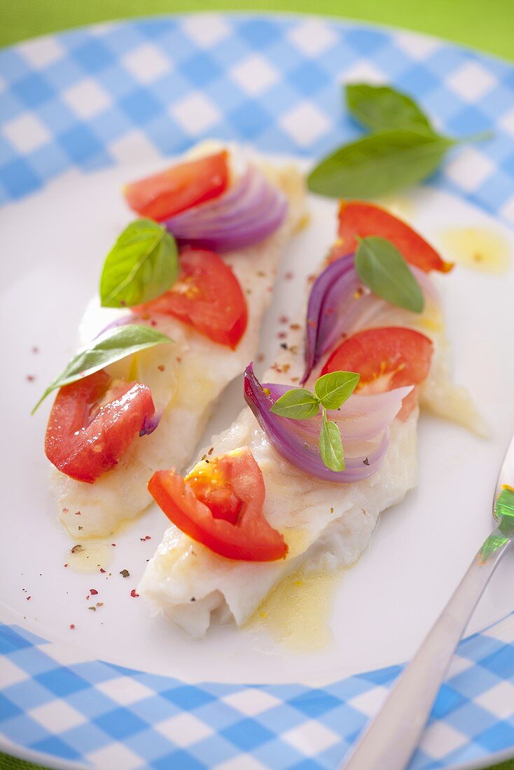 Trout fillets with tomatoes and red onions