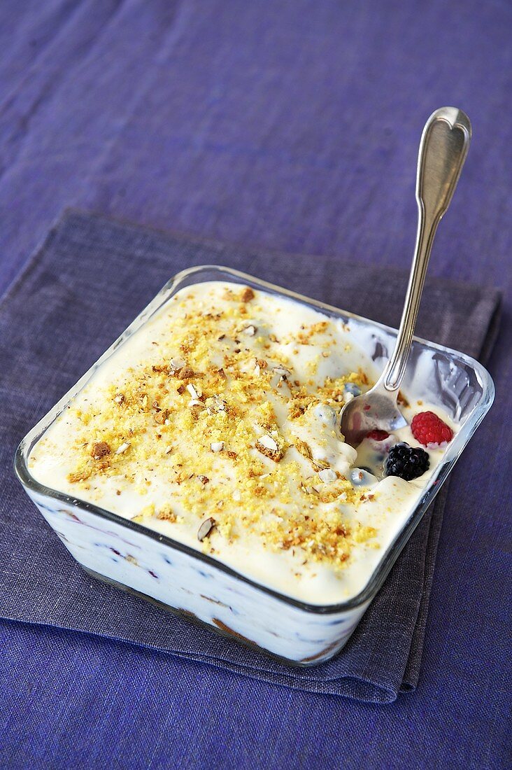 Berry trifle with white chocolate sauce and cantucci