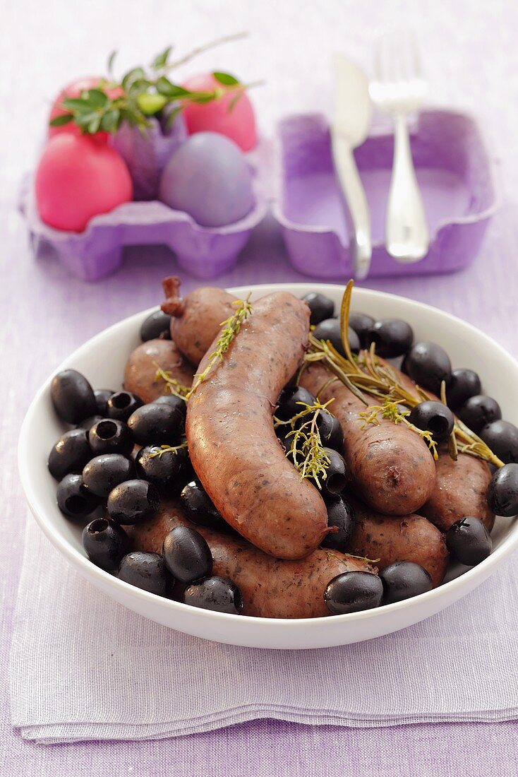Sausages with black olives