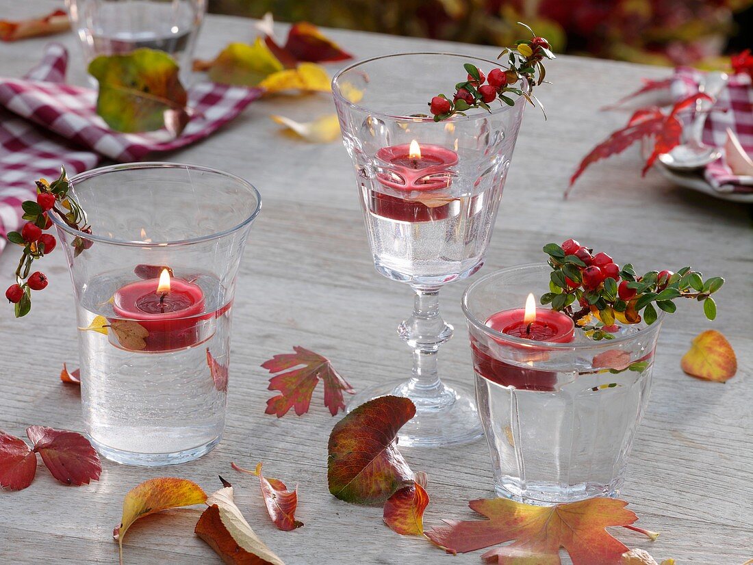 Autumnal table decoration with floating candles