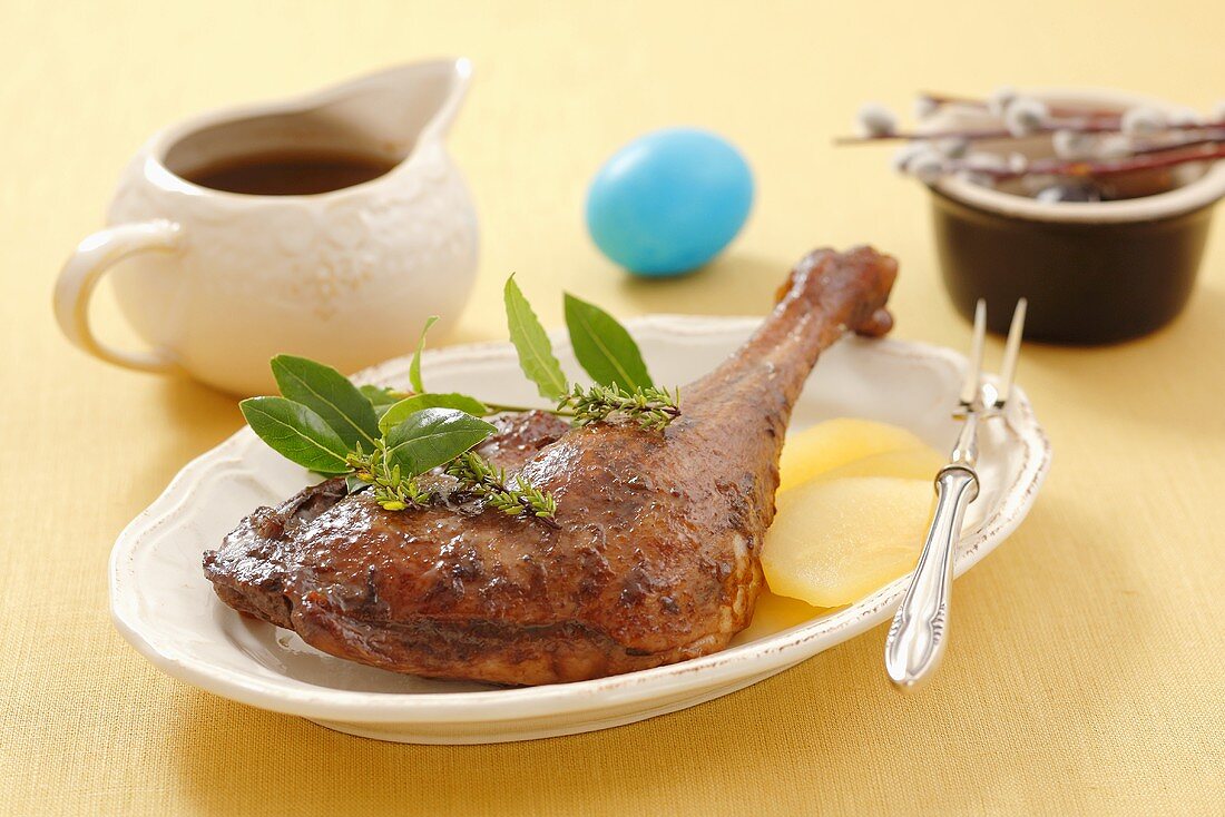 Glazed goose leg with marinated pears for Easter