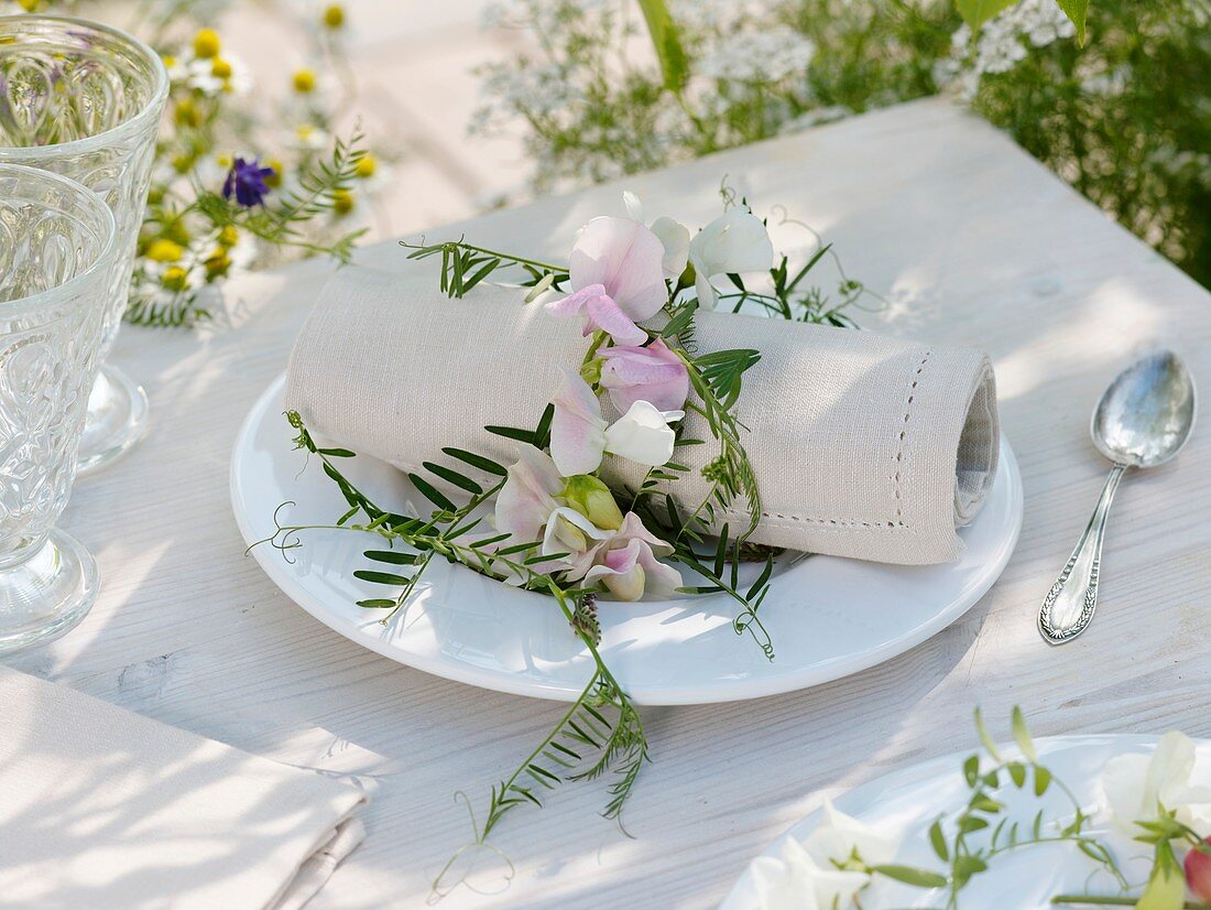 Napkin ring of sweet peas and vetch tendrils