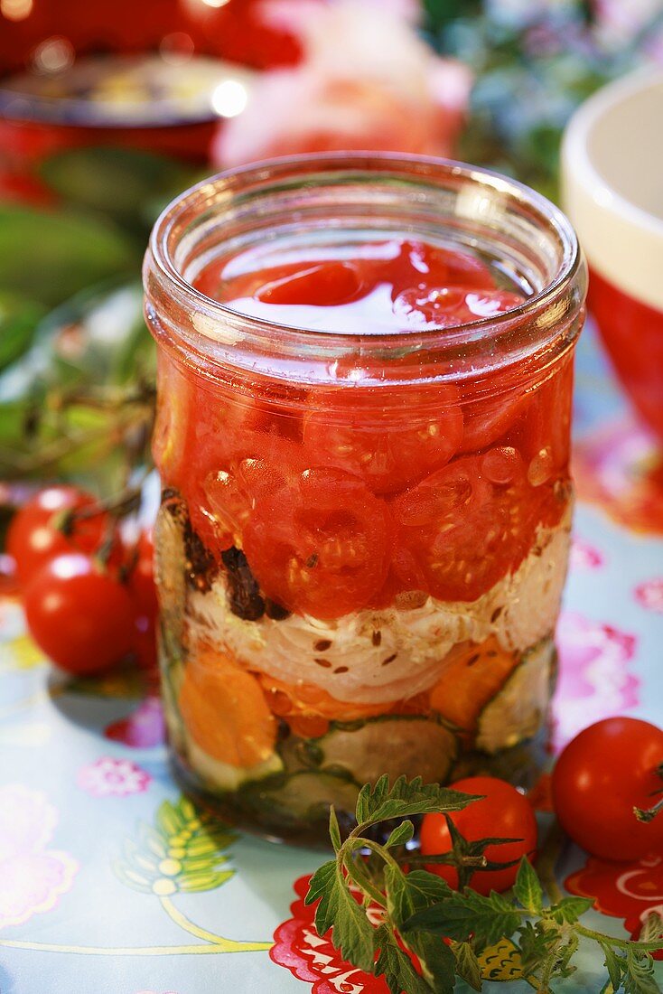 Pickled tomato salad in preserving jar