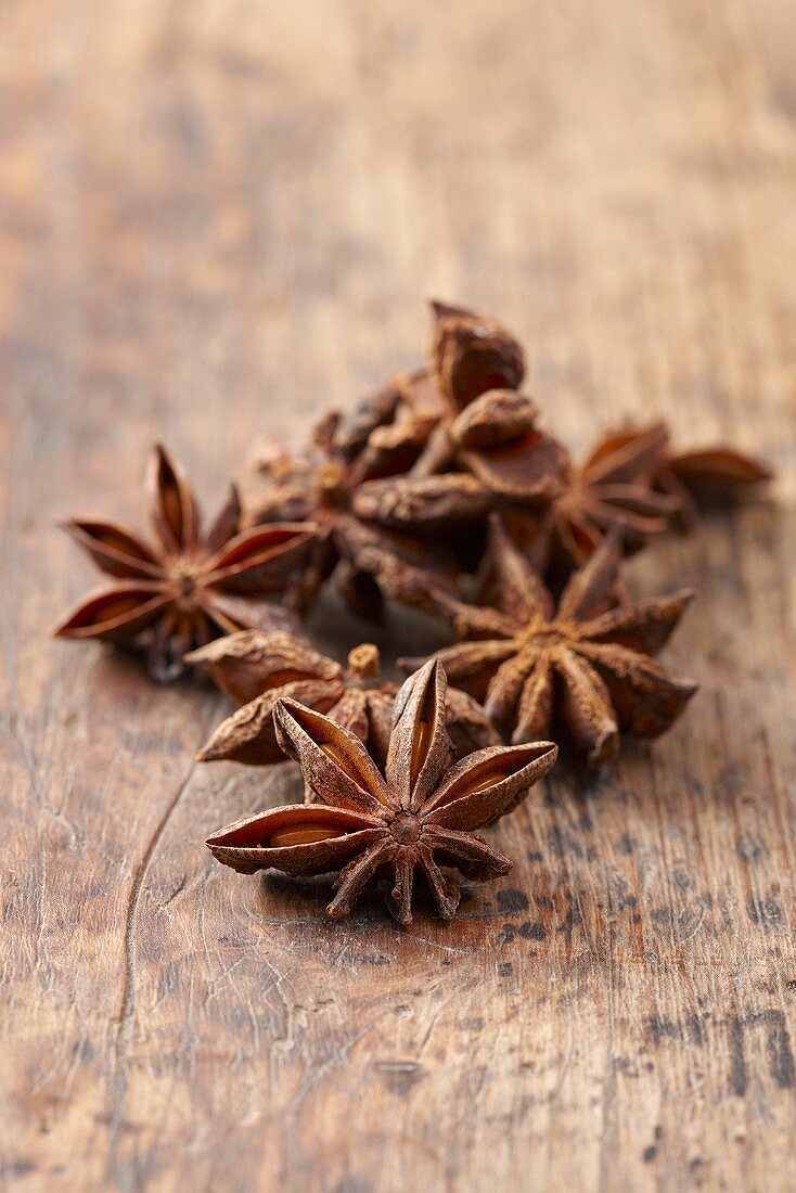 Anise stars on a wooden surface