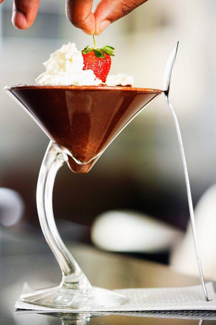Chocolate mousse with cream and strawberry