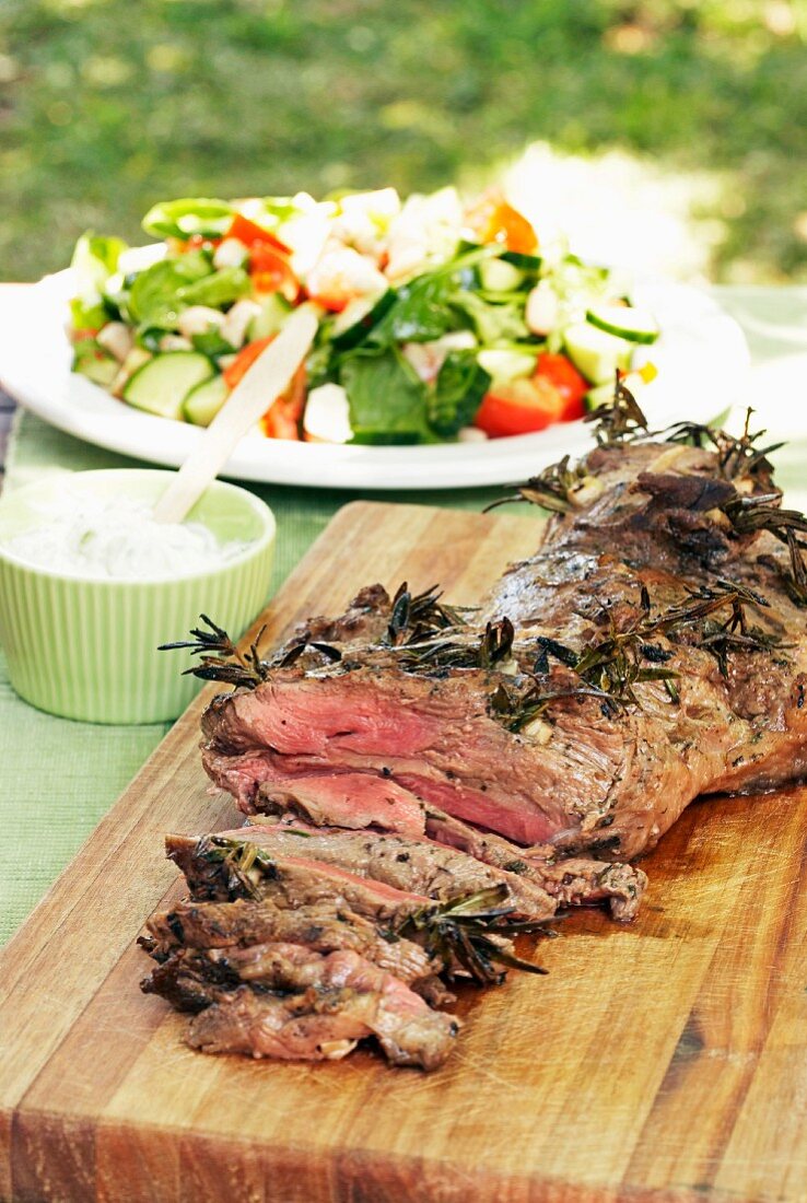 Leg of lamb with herbs and vegetable salad