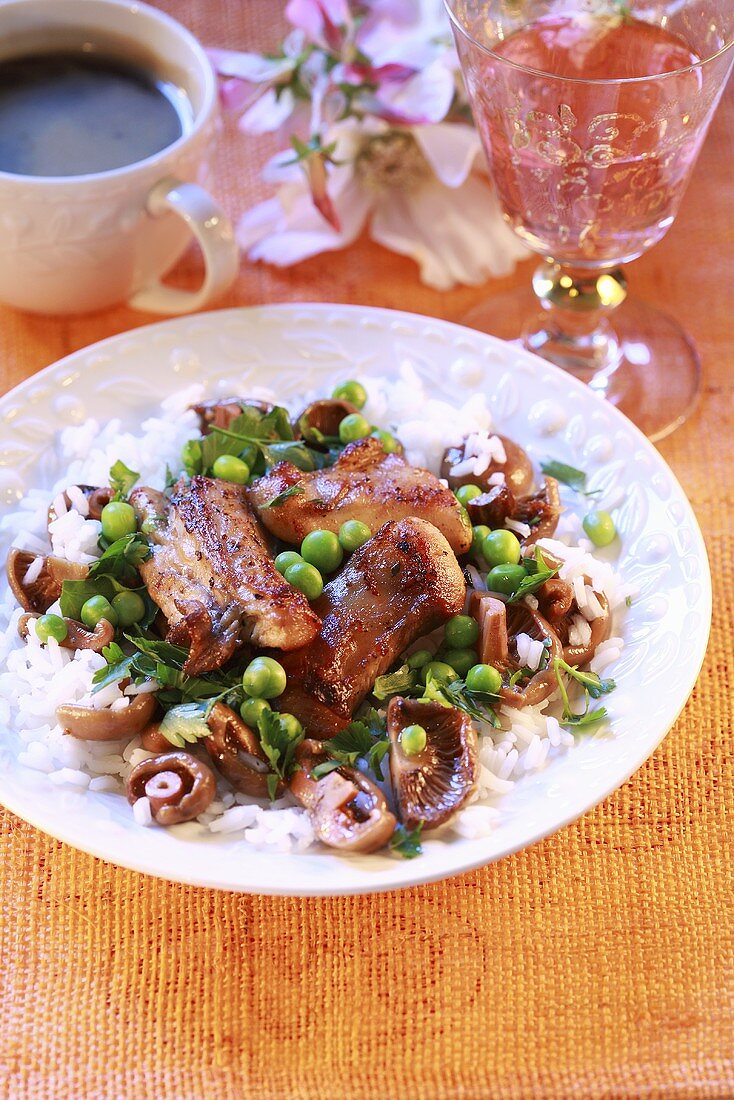 Rabbit with rice, peas and mushrooms