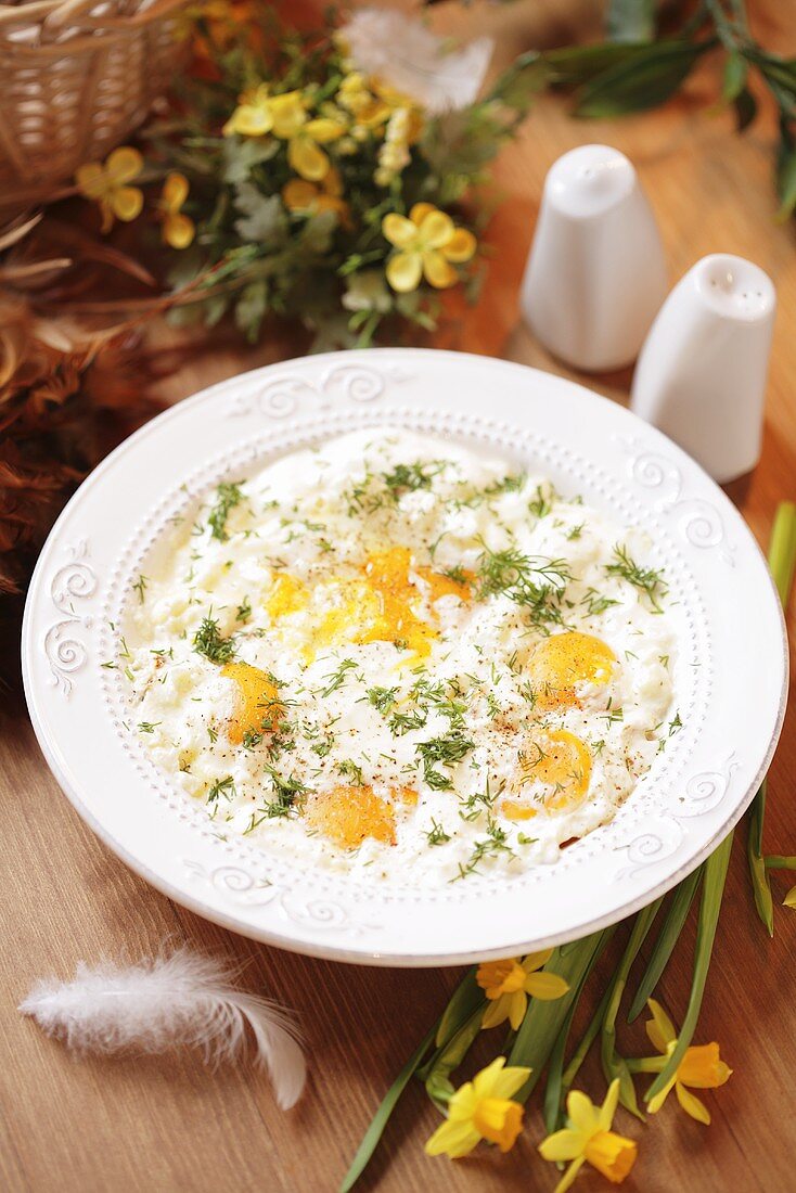 Fried eggs with cream and herbs for Easter