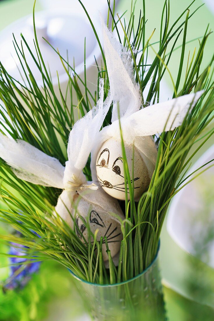 Easter eggs with chives in vase