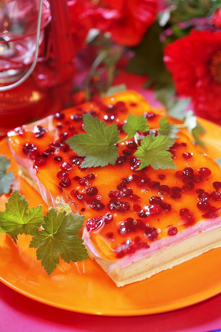 Banana cake with jelly and redcurrants