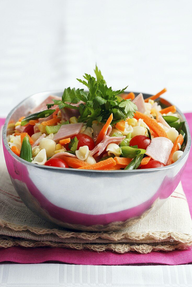Pasta salad with ham, spring onions and carrots