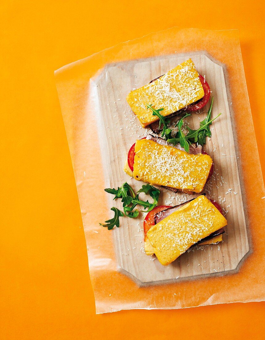 Polenta sandwiches with ham and tomato filling