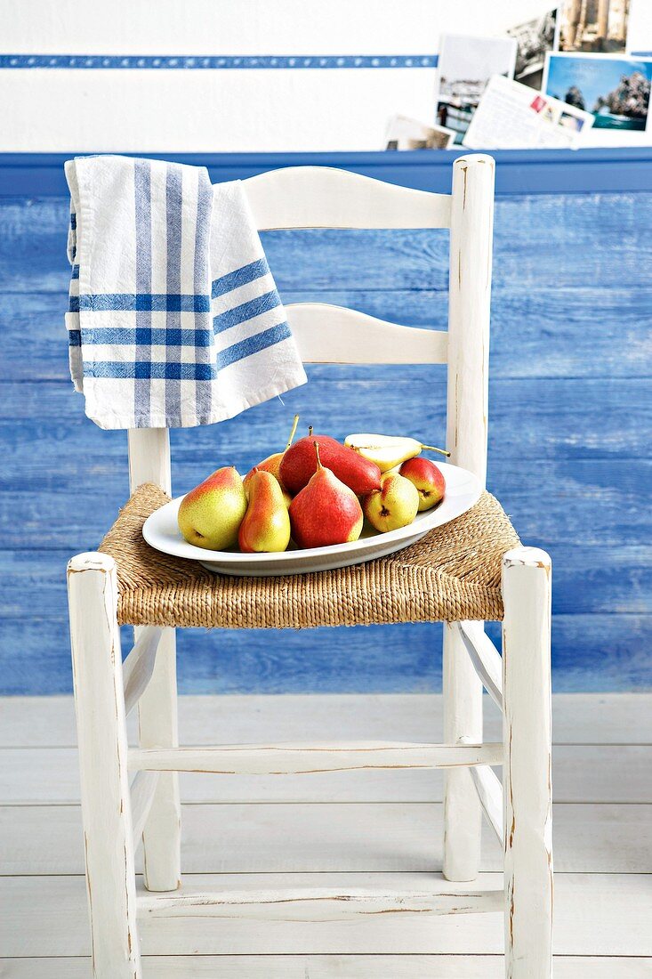 Tray of pears on chair
