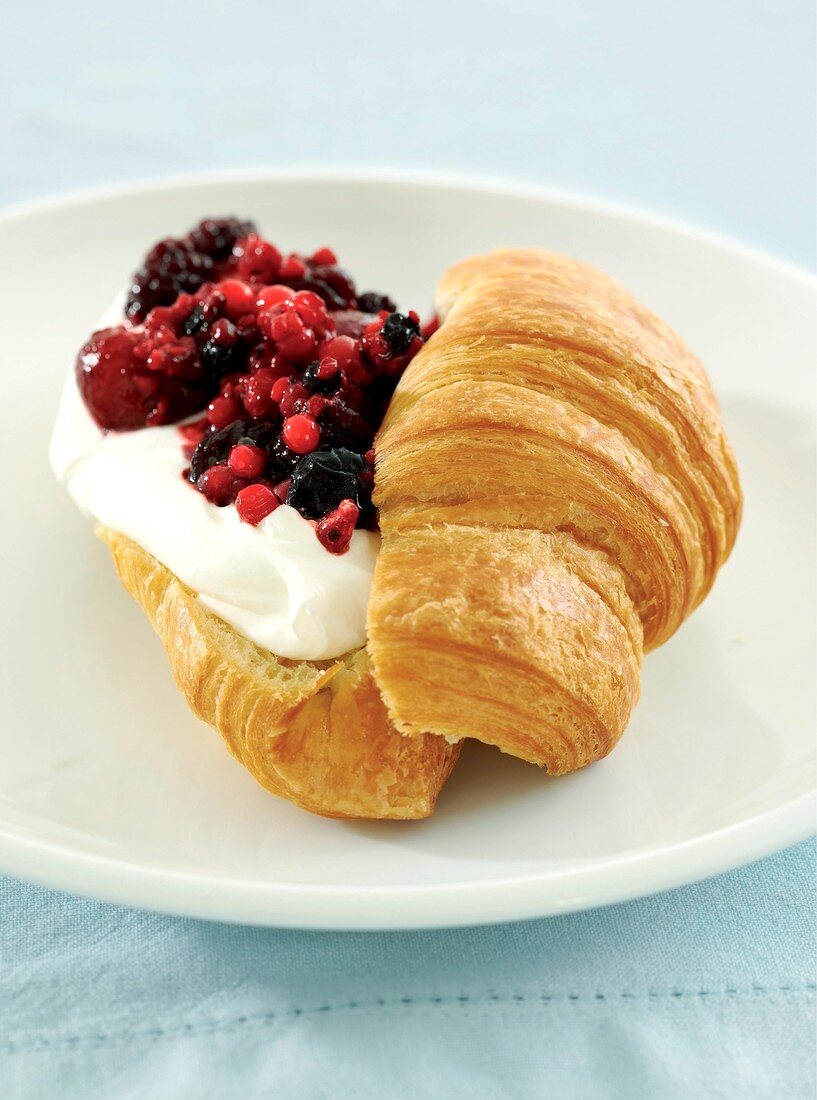 Croissant with cream and berries
