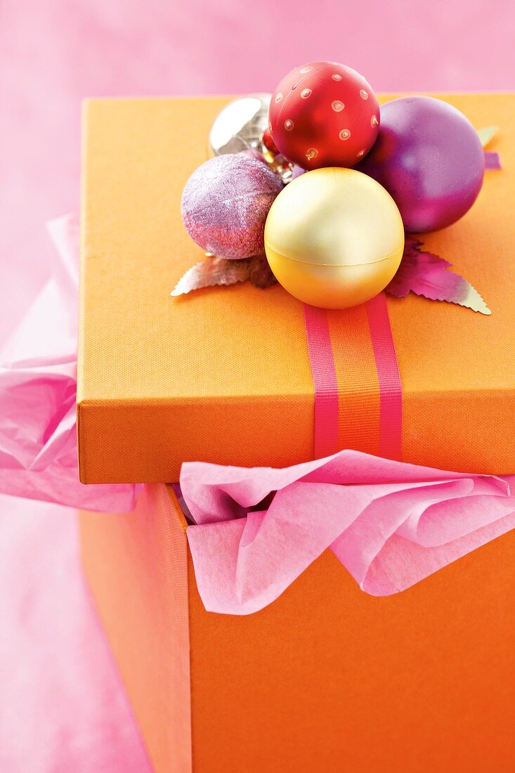 Gift box with Christmas baubles