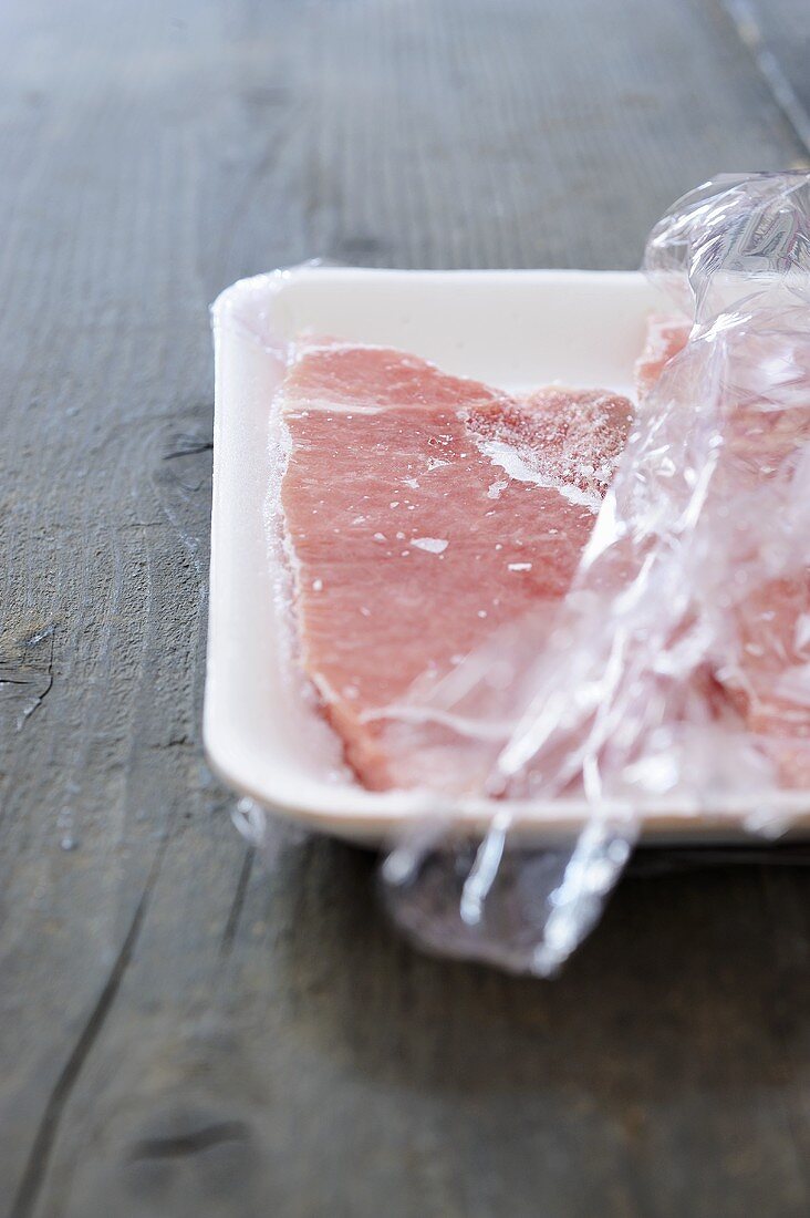 Frozen veal escalopes in polystyrene tray