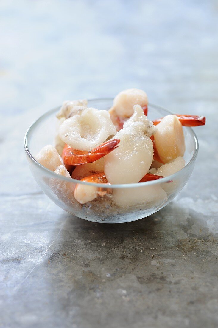 Frozen seafood in glass dish