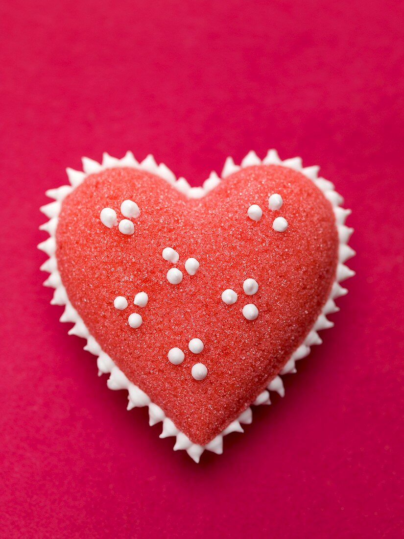 Red sugar heart with white spots
