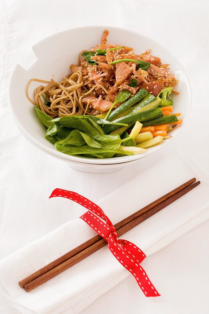 Sweet and sour noodle stir-fry with ham and vegetables