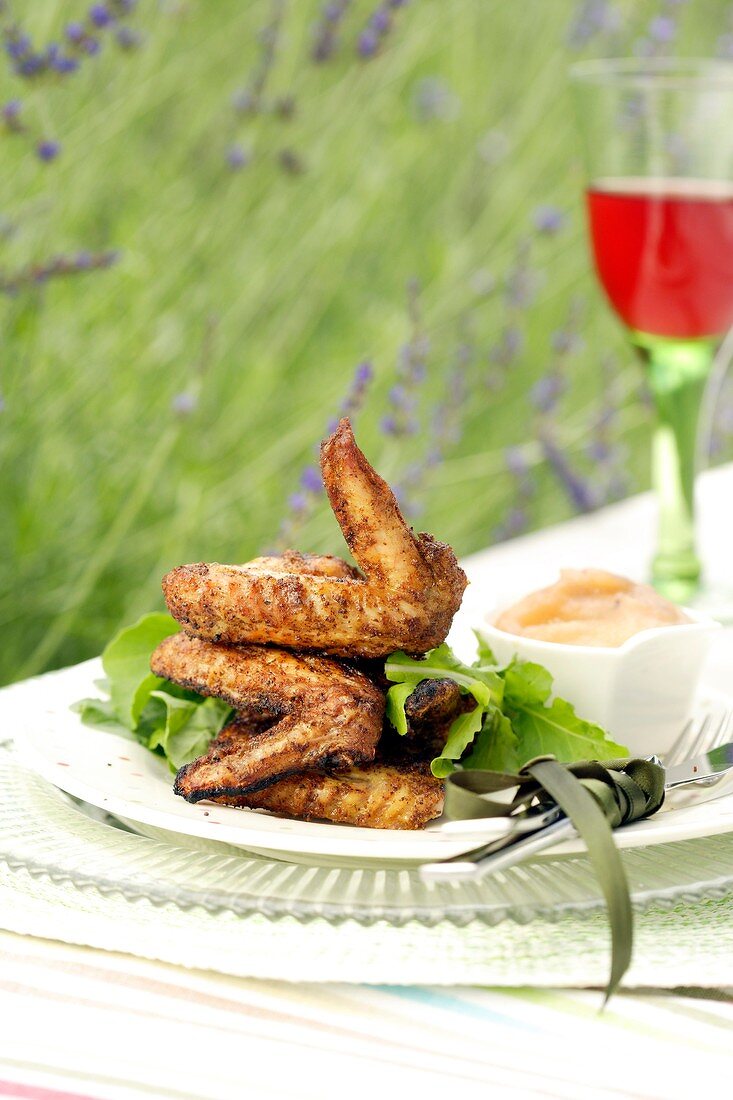 Barbecued smoked chicken wings with apple sauce