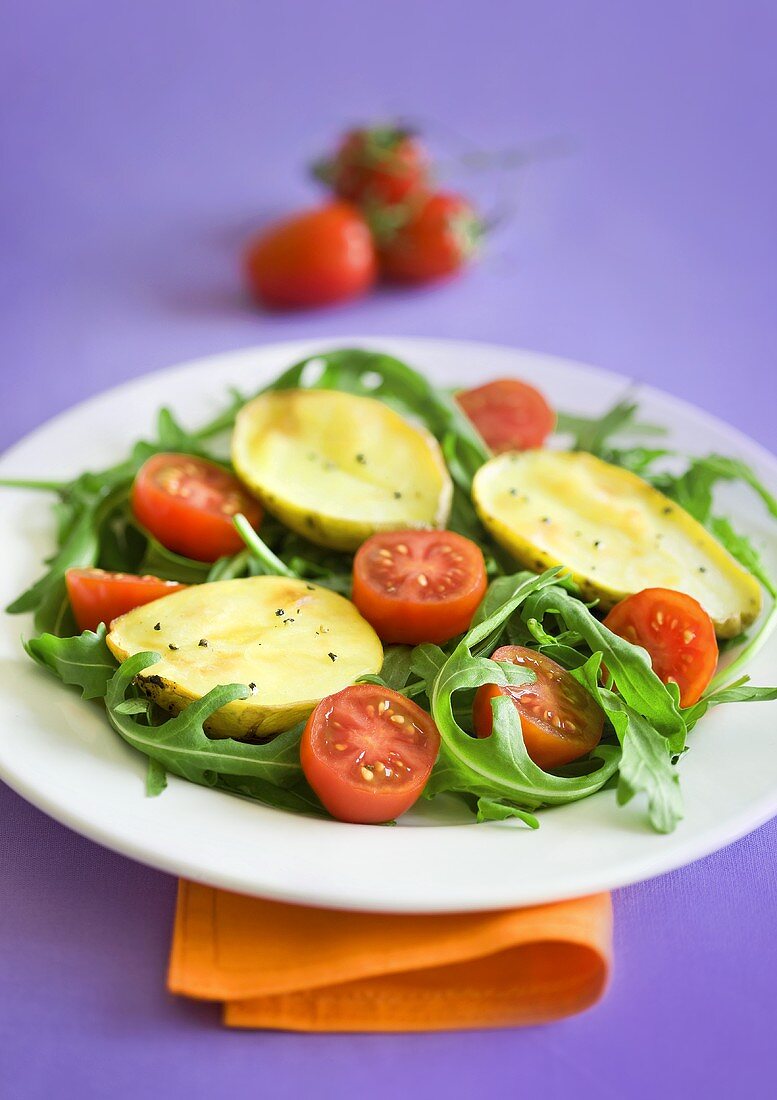 Rocket and tomato salad with baked potatoes