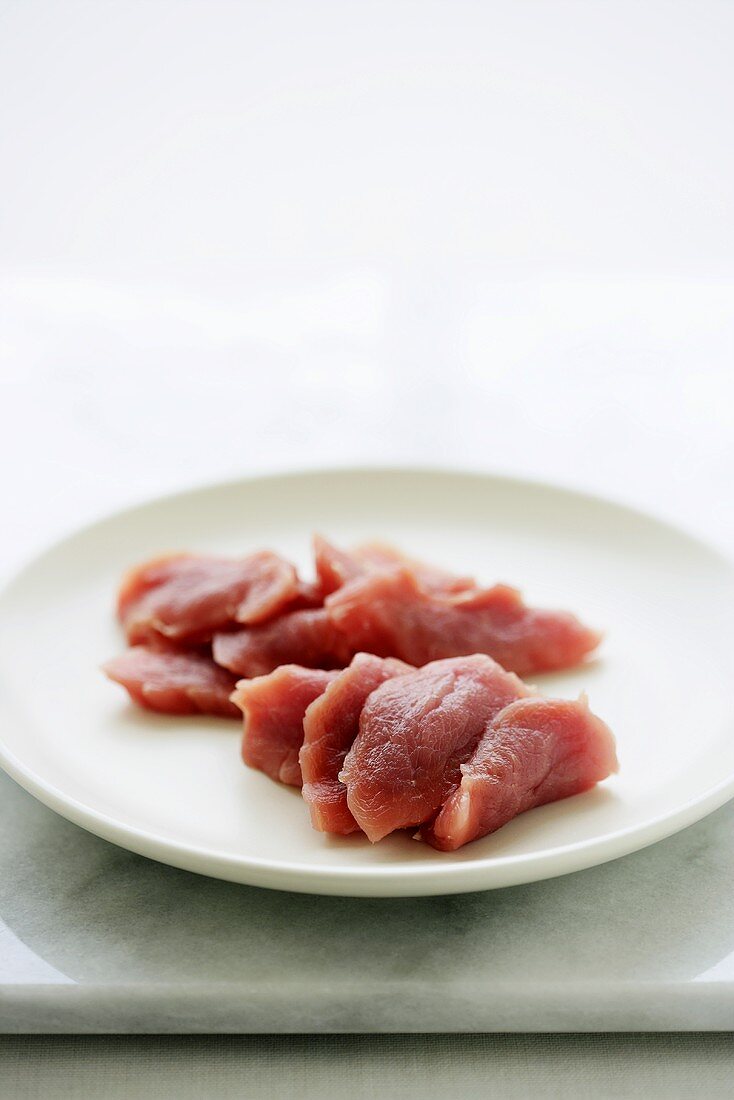 Fresh pork fillet, sliced