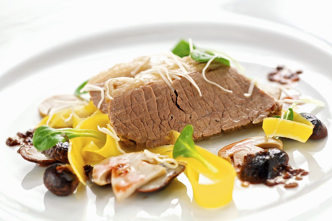 Boiled beef with pickled ceps and corn salad