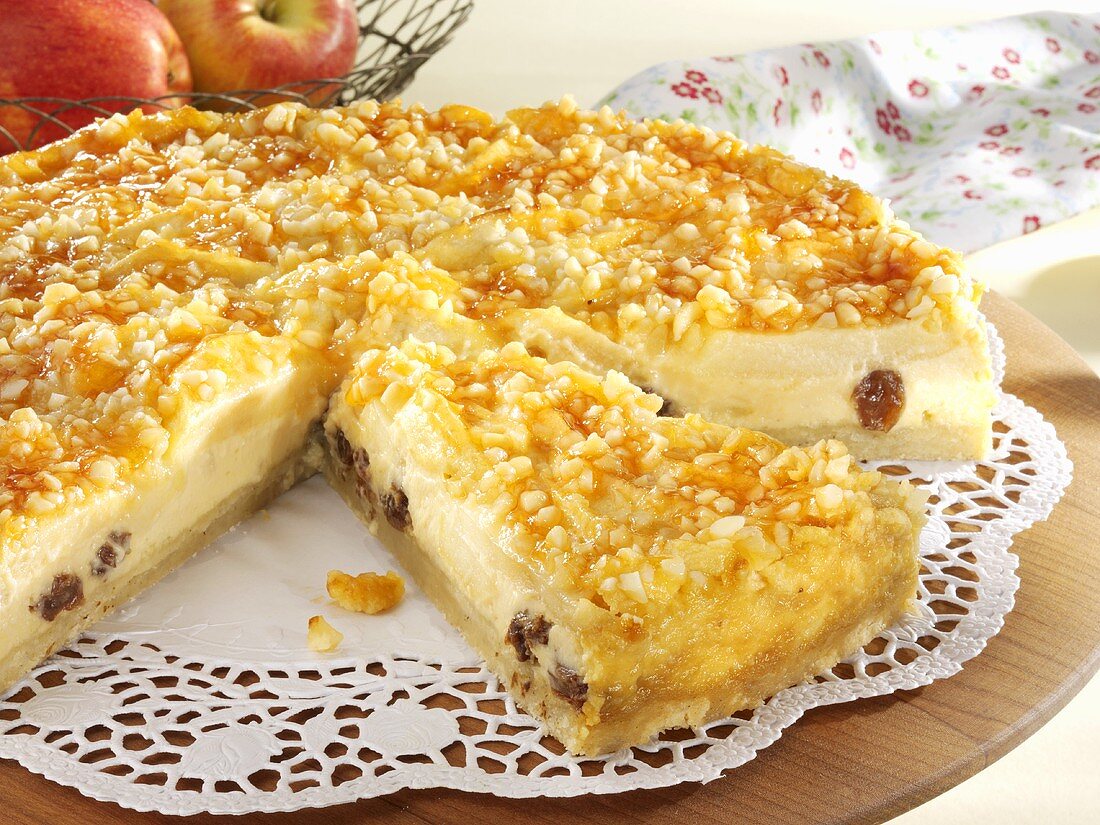 Cheesecake with apples and raisins, a piece cut