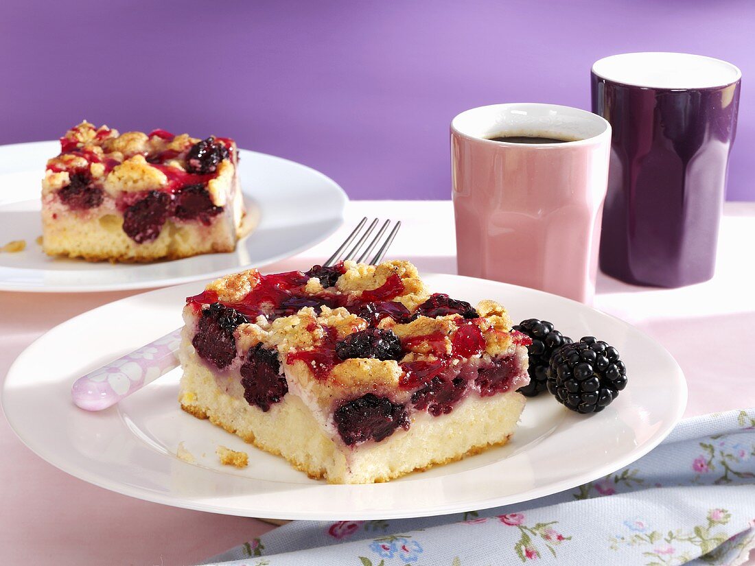 Two pieces of blackberry sour cream cake