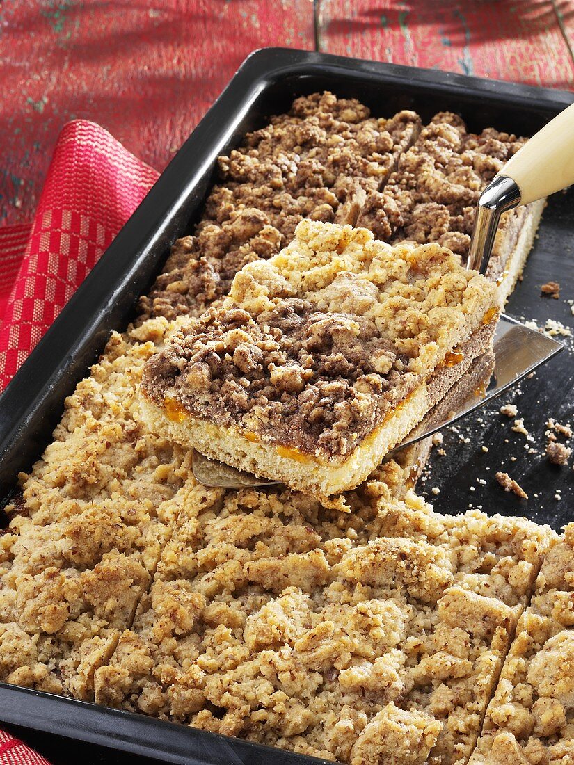 Light and dark crumble cake on baking tray