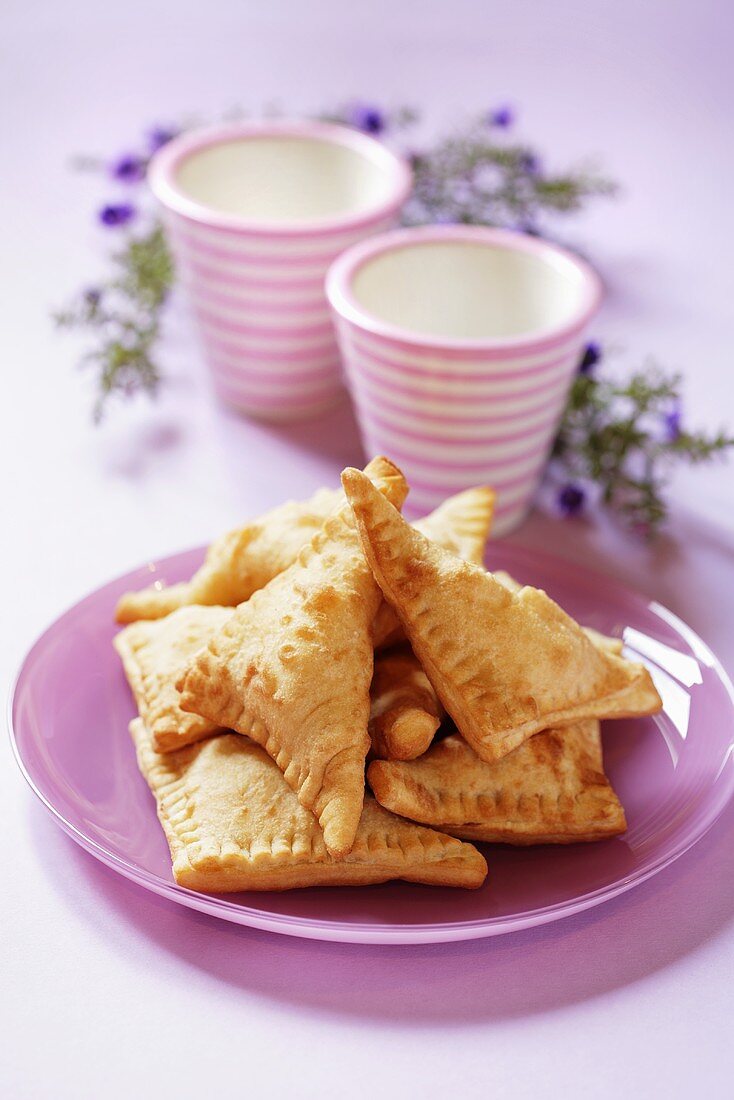 Several apple turnovers on plate