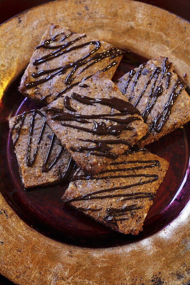 Nut biscuits with chocolate drizzle icing