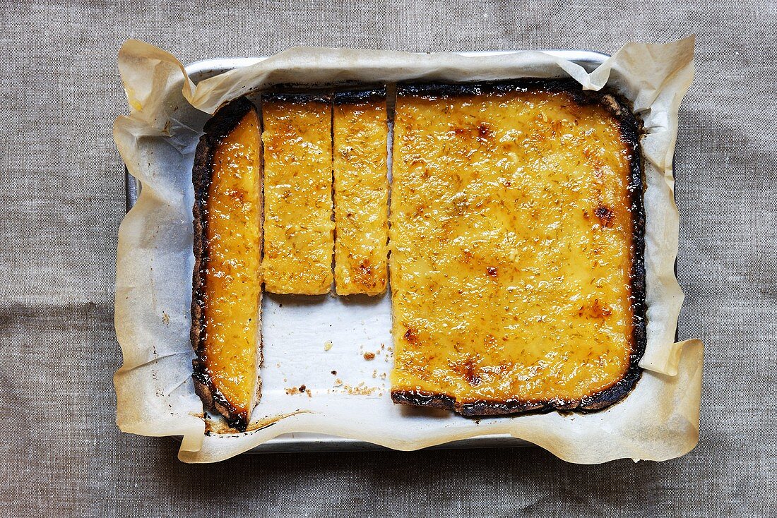 Lemon cake with a piece removed