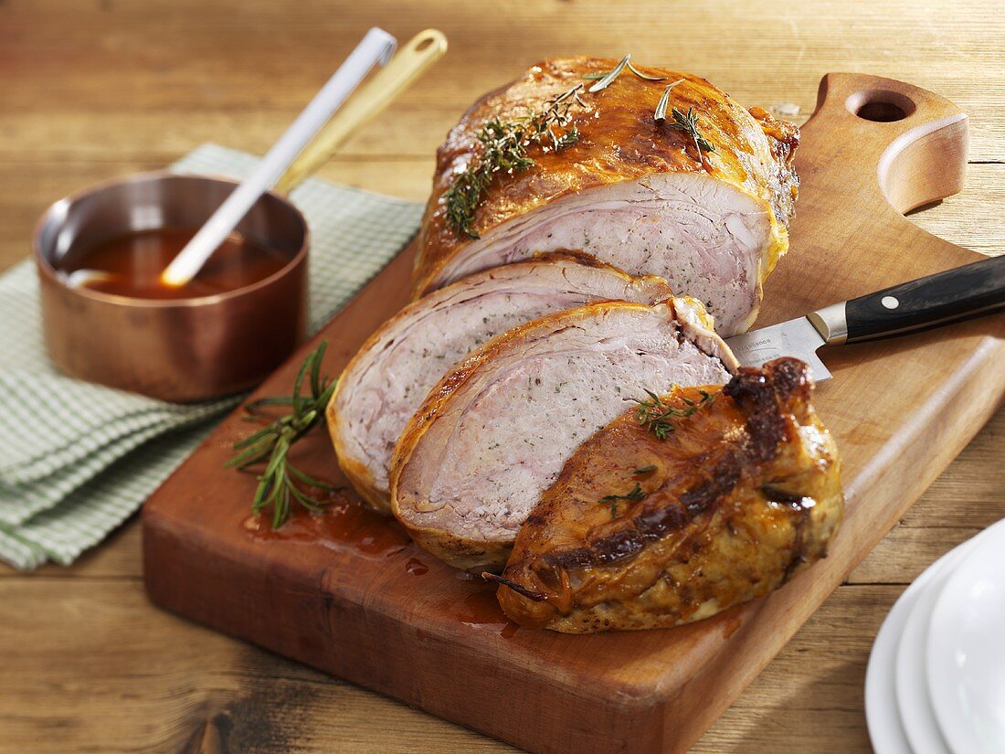 Stuffed breast of veal on chopping board