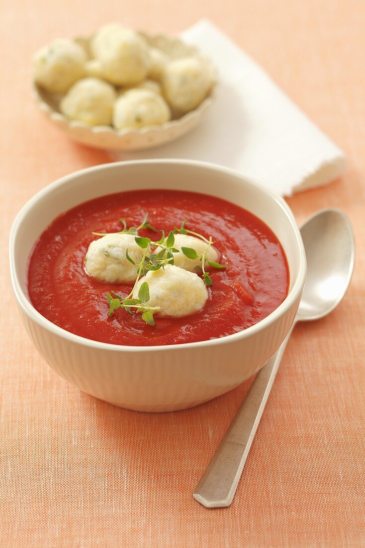 Cream of tomato soup with goat's cheese dumplings