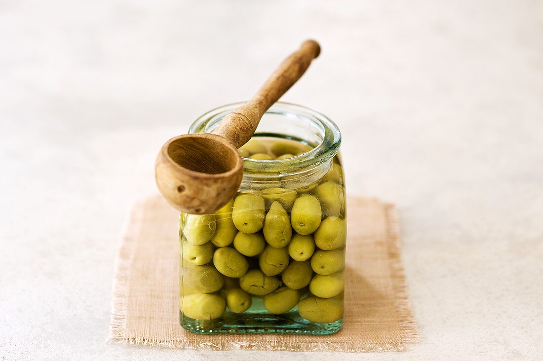 Olive cassées (Bottled cracked green olives, France)