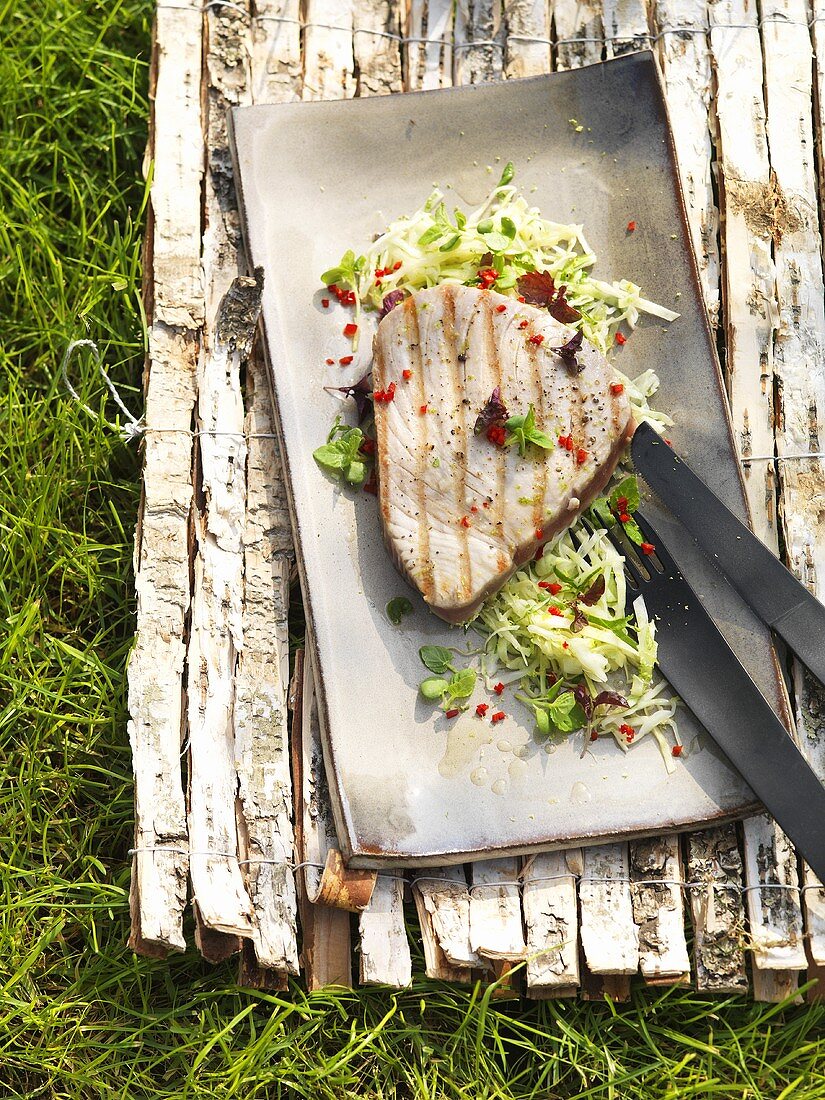 Barbecued tuna steak with lime cabbage