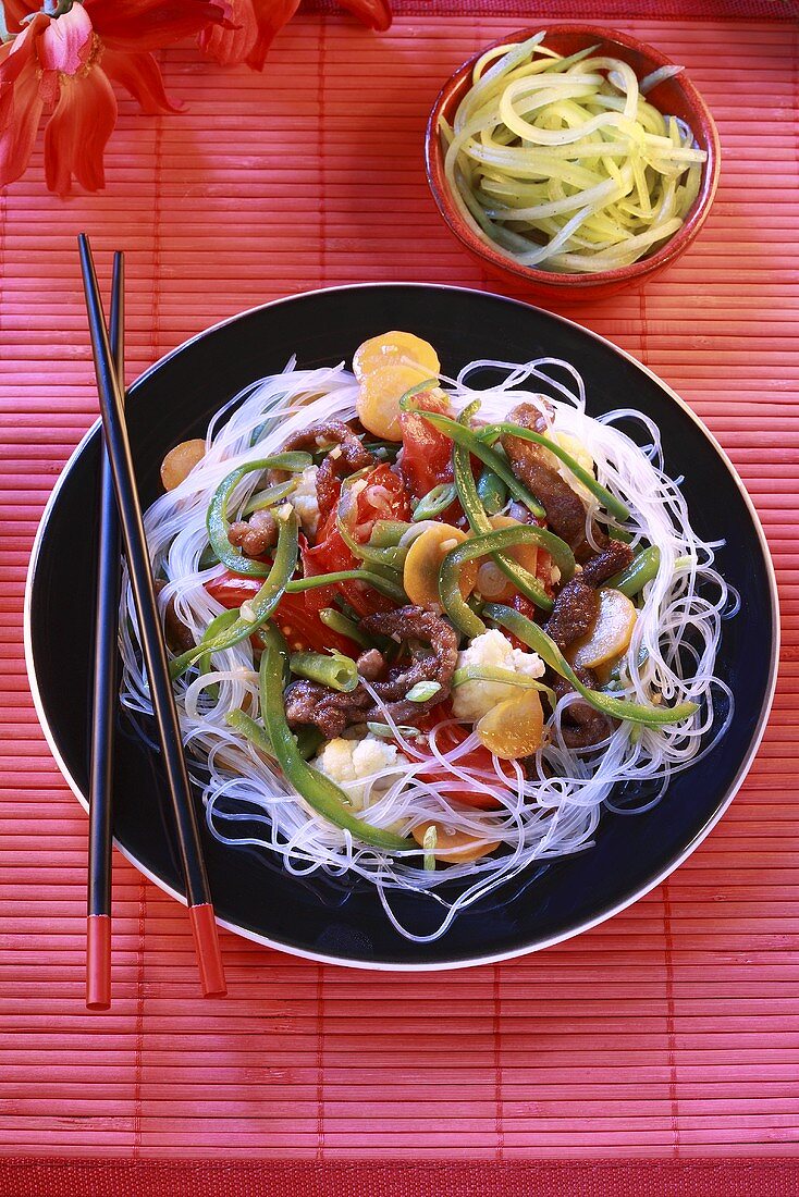 Beef and vegetable stir-fry on rice noodles