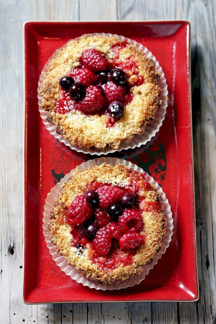 Raspberry and blueberry tarts (overhead view)