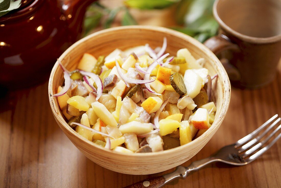 Potato salad with herring and gherkins