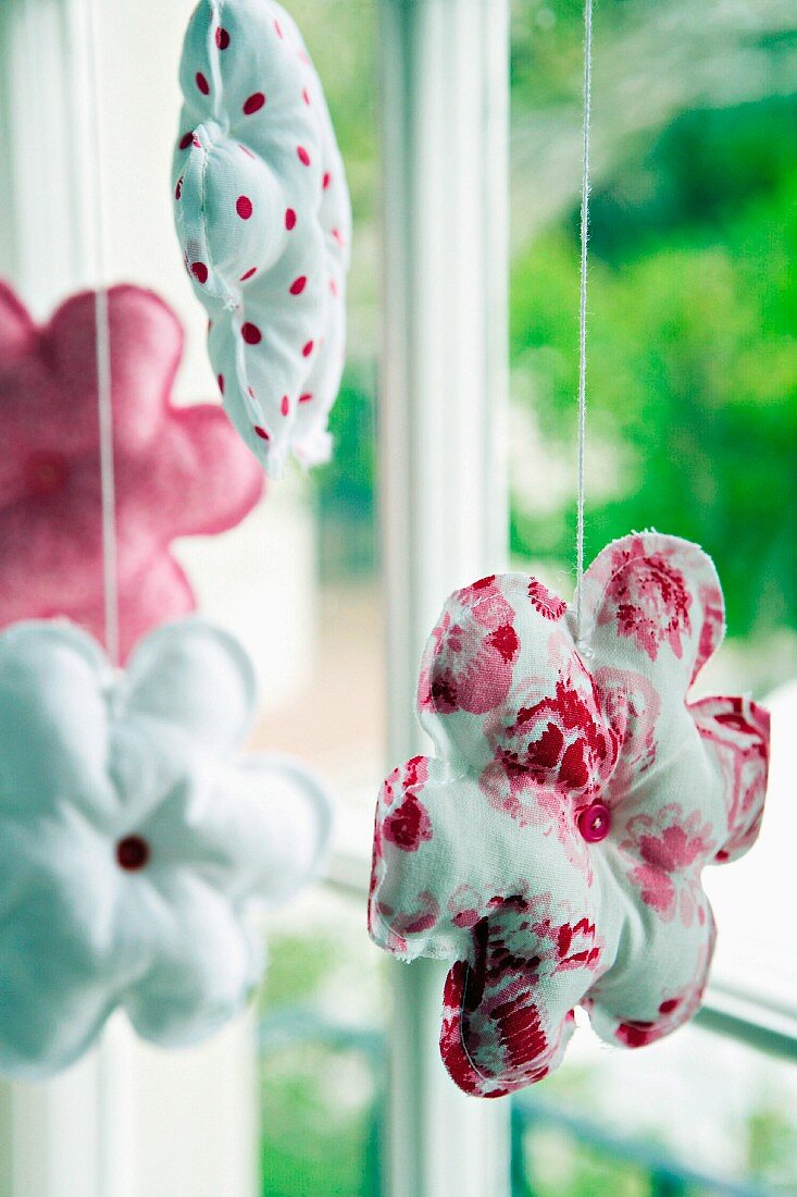 Quilted, fabric flowers decorating window