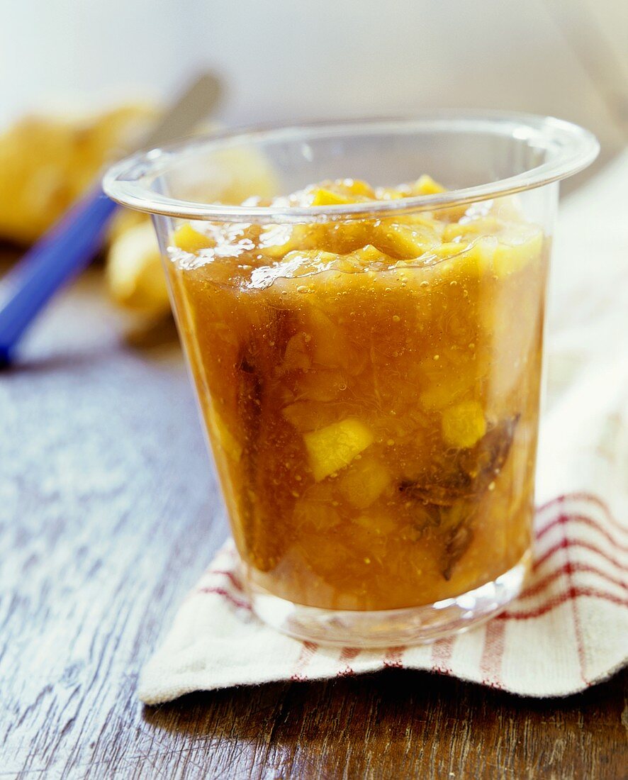 Fig, pineapple and papaya jam in a glass