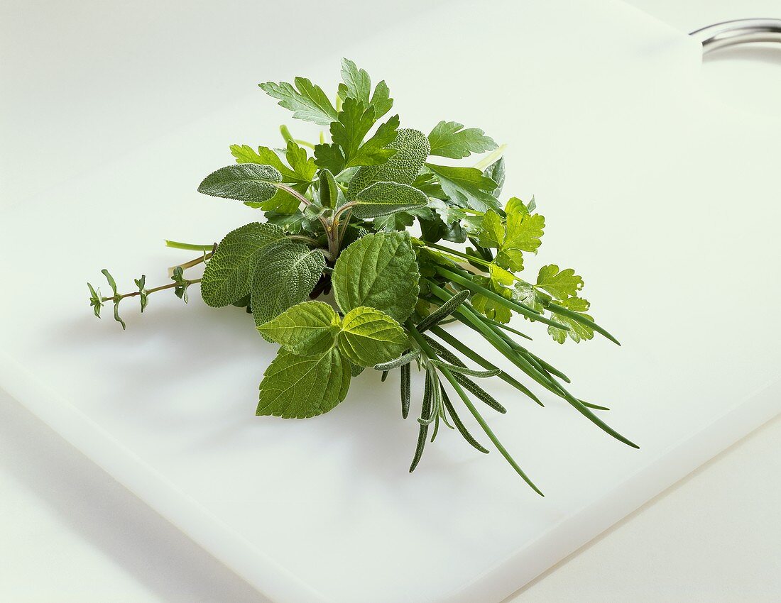 Bunch of herbs on a chopping board