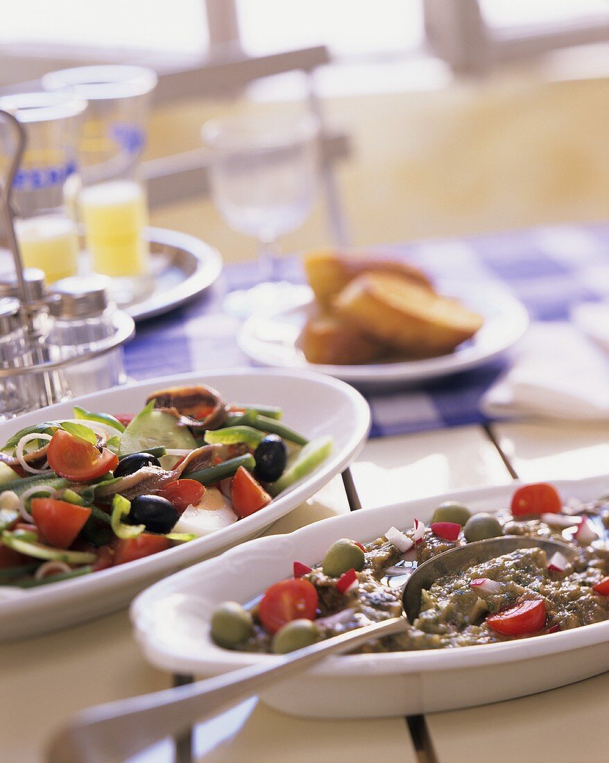 Specialities from S. of France: salade niçoise and olive puree