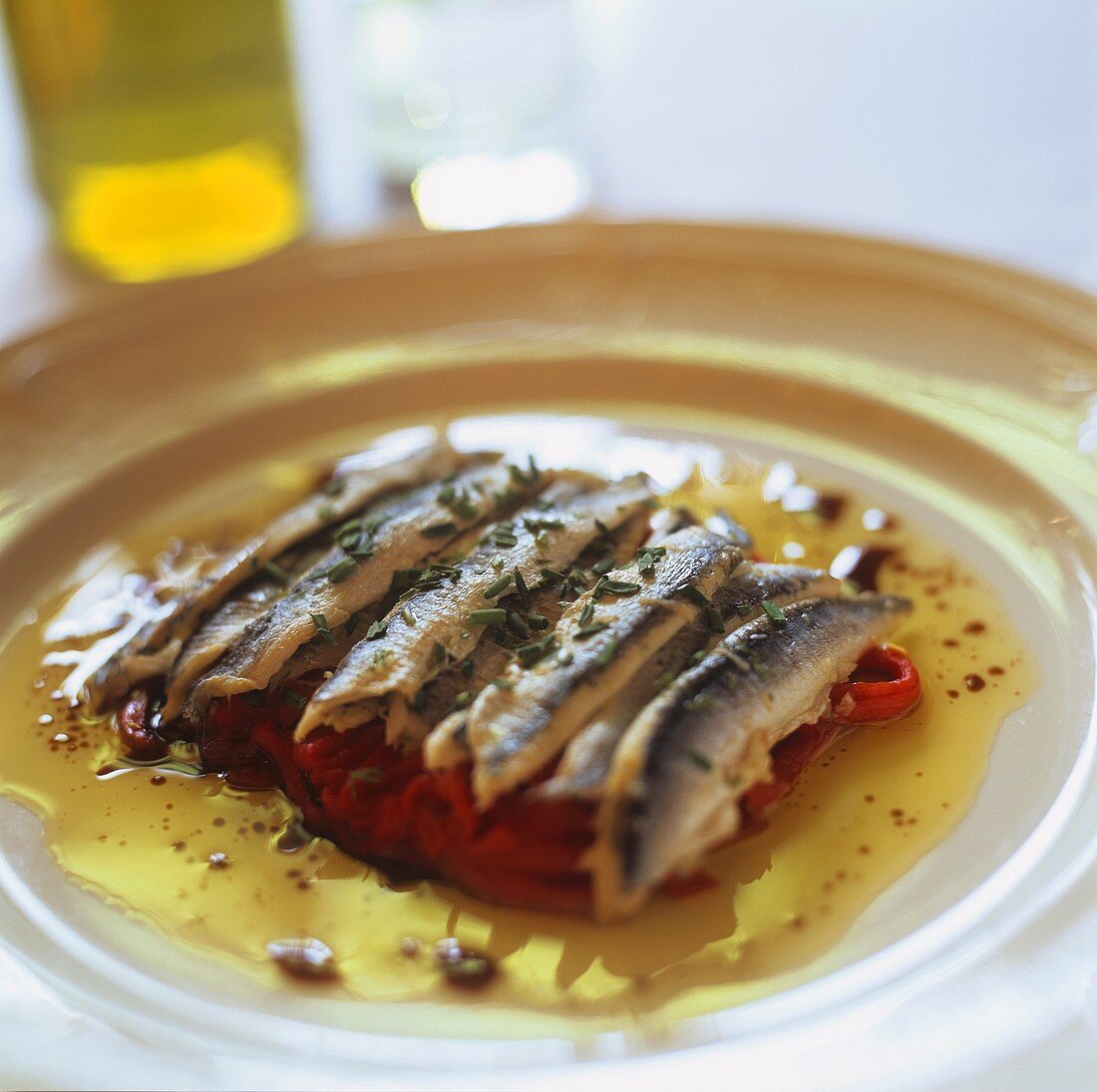 Sardines on peppers with olive oil