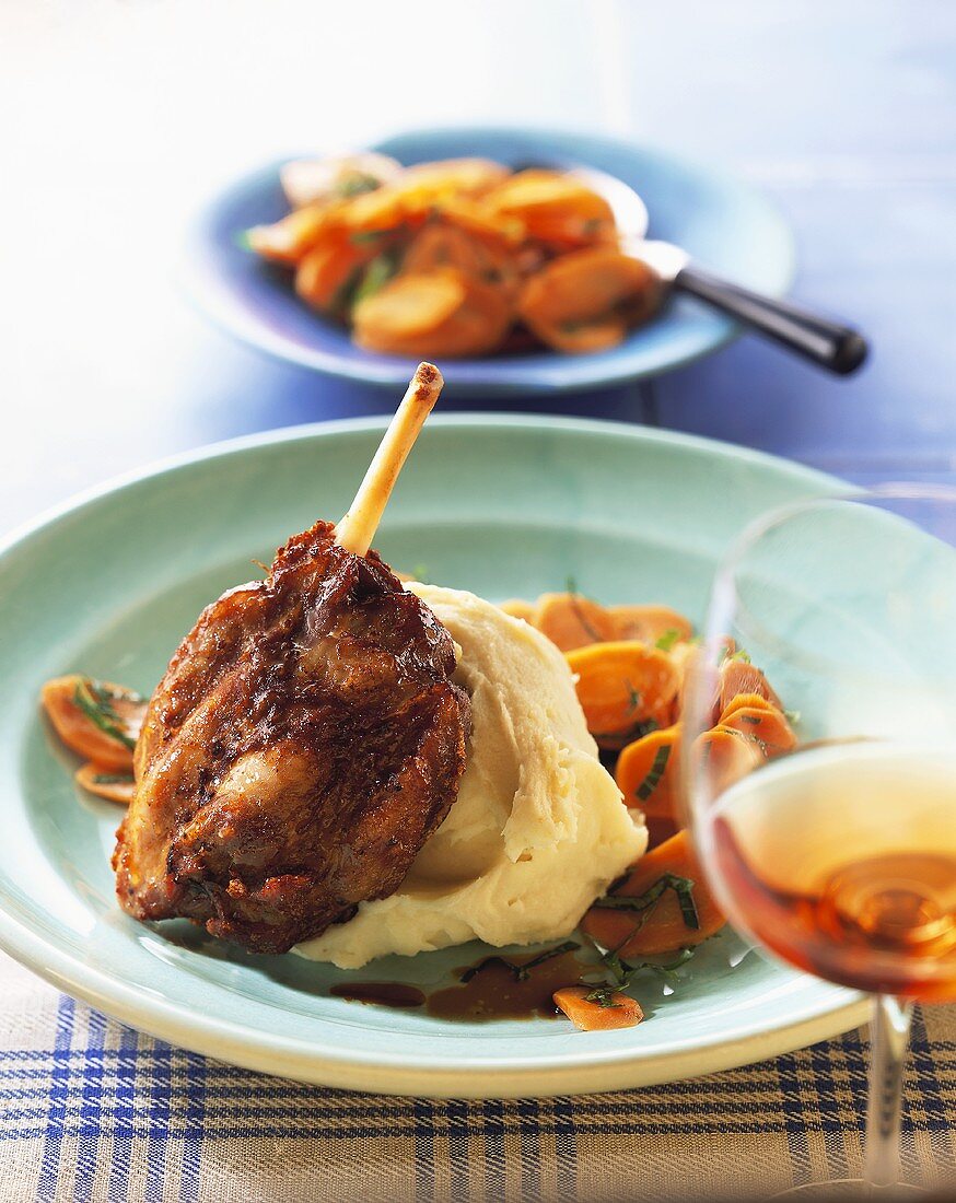 Turkey shank with mashed potato and carrots