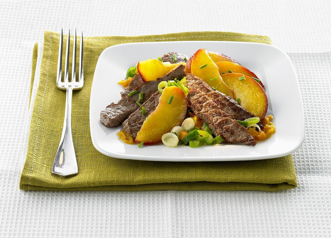 Beef fillet, sliced, with nectarine slices